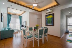 a living room with a table and chairs and a couch at *Ha Long Homestay @ Ha Long Bay View-3 BR in Ha Long
