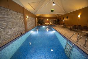a large swimming pool in a hotel room at Towers Hotel in Buraydah