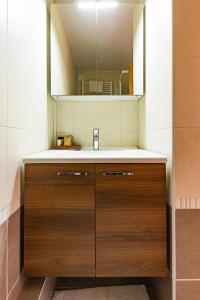 a bathroom with a sink and a mirror at Central modern Duplex for 6 by Avoriaz Chalets in Avoriaz