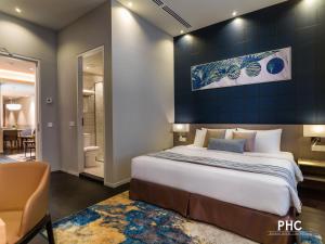 Postel nebo postele na pokoji v ubytování Ropewalk Piazza Hotel Managed by The Ascott Limited