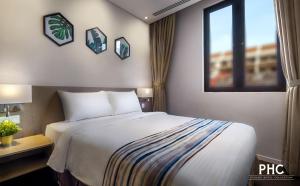 Postel nebo postele na pokoji v ubytování Ropewalk Piazza Hotel Managed by The Ascott Limited