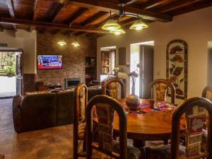 a living room with a table and a couch at Casa Rural Vely para 8 personas in Abándames