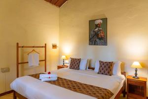 Letto o letti in una camera di StayVista at Firefly By The River with Breakfast