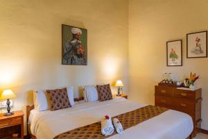 Letto o letti in una camera di StayVista at Firefly By The River with Breakfast