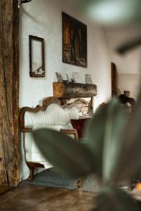 a living room with two couches and a fireplace at Rajska Willa in Rajcza