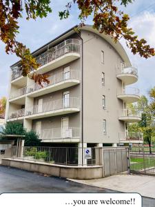 a tall apartment building with balconies on it at UN PUNTO A VERONA in Verona