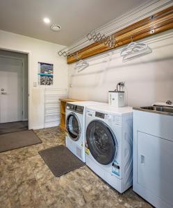 a laundry room with a washer and dryer at Ruapehu Retreat in National Park