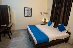 Postel nebo postele na pokoji v ubytování Hotel Lambodar