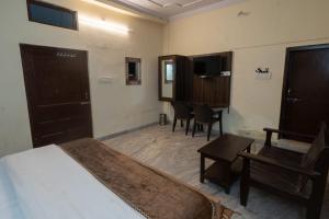 Postel nebo postele na pokoji v ubytování Hotel Lambodar