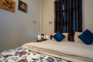 Postel nebo postele na pokoji v ubytování Hotel Lambodar