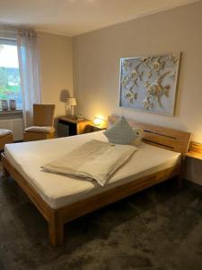 Ein Bett oder Betten in einem Zimmer der Unterkunft Gasthaus Hotel Rosenboom
