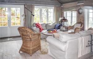a living room with couches and a table and chairs at 4 Bedroom Pet Friendly Home In Eggedal in Eggedal