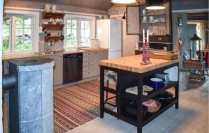 a kitchen with a island in the middle of it at 4 Bedroom Pet Friendly Home In Eggedal in Eggedal