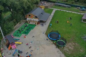 an aerial view of a play park with people and tents at Lumea Copiilor Karina&Adelin Lupeni in Lupeni