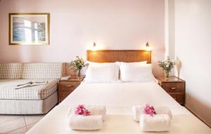 Postel nebo postele na pokoji v ubytování Hotel Paralio