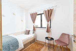 Apartments & Rooms Fisherman's Luck客房内的一张或多张床位