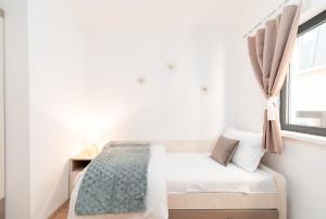 Apartments & Rooms Fisherman's Luck客房内的一张或多张床位