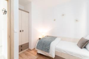 Apartments & Rooms Fisherman's Luck客房内的一张或多张床位