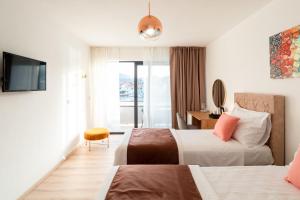 Apartments & Rooms Fisherman's Luck客房内的一张或多张床位