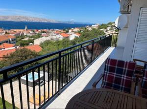 a balcony with a view of a city at Apartments Lili in Senj