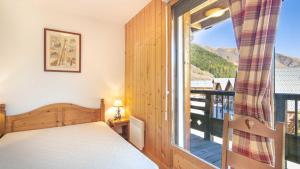 Posteľ alebo postele v izbe v ubytovaní Les Marmottes- 38- Appart Vue montagne- 4 pers