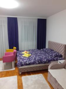 Кровать или кровати в номере Apartman JOVANA