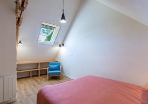 Łóżko lub łóżka w pokoju w obiekcie Gîte de l'Abbaye