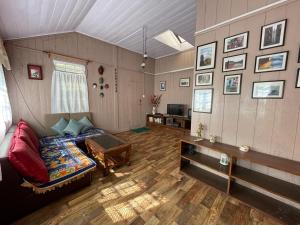 a living room with a couch and a table at Darjeeling BnB in Darjeeling