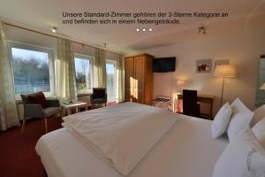 Ein Bett oder Betten in einem Zimmer der Unterkunft Hotel Antoniushütte