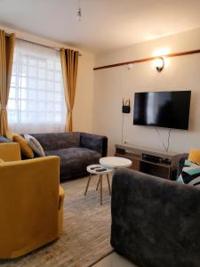 Μια τηλεόραση ή/και κέντρο ψυχαγωγίας στο Yvonne furnished home