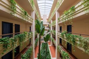 an office building with plants on the balconies at Estival Islantilla in Islantilla