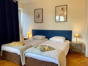 Posteľ alebo postele v izbe v ubytovaní Appartement Gare Strasbourg Parking
