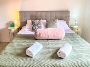 a bedroom with a bed with two pillows on it at Villa Vinka in Kozica +19 photos