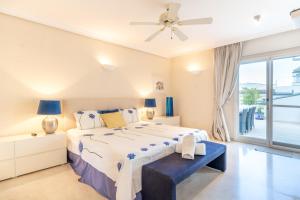 a bedroom with a large bed and a window at VIP Dominion Beach Estepona in Estepona +187 photos