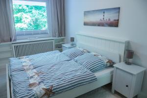 Postel nebo postele na pokoji v ubytování Ferienwohnung Glücksburg 3322