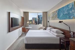 Postel nebo postele na pokoji v ubytování Hyatt Regency Brisbane