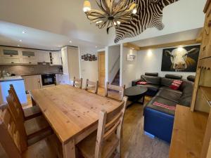 a kitchen and living room with a large wooden table at Appartement Tignes, 4 pièces, 6 personnes - FR-1-480-2 in Tignes