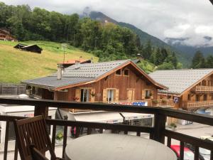 a view from the balcony of a house at Studio Samoëns, 1 pièce, 2 personnes - FR-1-629-77 in Samoëns