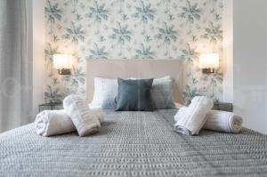Posteľ alebo postele v izbe v ubytovaní Lovely duplex with private parking near city center by REMS