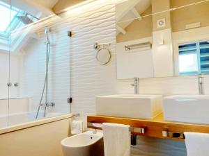 a bathroom with a sink and a shower at Hotel O Semaforo in Finisterre