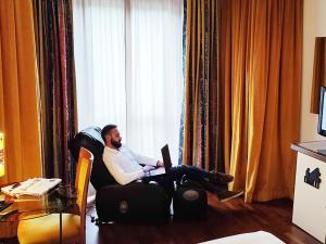 Телевизор и/или развлекательный центр в Hotel Giò Wine e Jazz Area