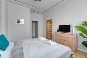 Posteľ alebo postele v izbe v ubytovaní Comfort Apartments Grobla II