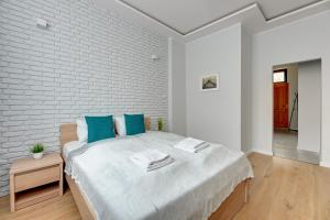 Posteľ alebo postele v izbe v ubytovaní Comfort Apartments Grobla II