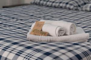 A bed or beds in a room at Genova-tra mare e centro storico