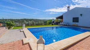 a swimming pool in the backyard of a house at Colladopino La Puebla de Los Infantes by Ruralidays in La Puebla de los Infantes