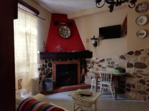 TV a/nebo společenská místnost v ubytování Casa Rural Abuela Maxi