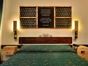 Кровать или кровати в номере Hotel Giò Wine e Jazz Area