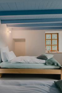 Cama ou camas em um quarto em Corippo Albergo Diffuso