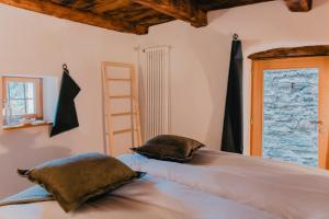 Cama ou camas em um quarto em Corippo Albergo Diffuso