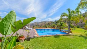 an image of a swimming pool in a yard at Casa Ana de Guaro by Ruralidays in Guaro